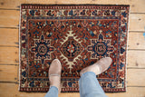 Vintage Karaja rug featuring sharp contouring, intricate Heriz-style geometric motifs in brick red and navy.