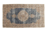 Distressed vintage Turkish Sparta rug with sky blue field, antique ivory European medallion.