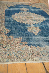 Detail of distressed Turkish Sparta rug, showing worn sky blue pile and light foundation.