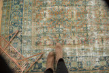 Distressed vintage Mahal carpet with Herati motif field and floral border in terra cotta, teal, and navy.