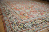 Distressed vintage Mahal carpet border with terra cotta, ivory, and teal floral motifs.