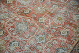 Distressed Mahal carpet showing terra cotta, teal, ivory tones, and wear to knot heads.
