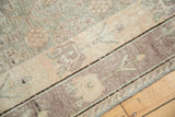 Distressed vintage Khotan carpet with geometric vinery, abrashes, and oxidized silver, blush, mauve tones.