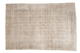 Distressed vintage Persian Birjand carpet, allover Herati motif, etched ivory, blue, and brown tones.