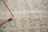 Distressed vintage Birjand carpet texture, revealing herati-inspired motif and visible wear.