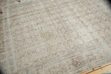 Distressed Birjand carpet border showing faded herati motifs and pale powder blue texture.