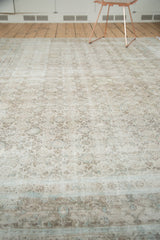Distressed Birjand carpet with etched texture, faded pale blue and ivory Herati pattern.