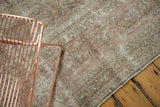 Distressed vintage Sivas rug, faded Herati motif in pale blush, ivory, and coffee brown tones.