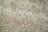 Textured Sivas carpet detail showing distressed Herati motif, soft silver, blush, ivory.