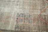 Distressed vintage Sivas carpet texture, with worn pale blush rose and oxidized silver patterns.