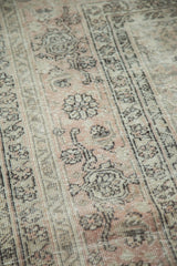 Worn pile surface of a vintage Sivas rug, displaying pale blush and oxidized silver Herati motifs.