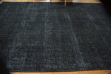 Fine woven texture of the distressed overdyed Sivas rug, with charcoal and indigo.