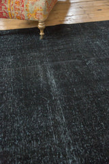 Distressed charcoal overdyed Sivas carpet, showcasing even wear and fine texture.
