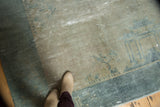 Distressed antique Peking carpet showing mix of pile, foundation, faded ivory, sea foam.