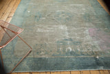 Distressed antique Peking carpet, faded pictorial patterns, sea foam blue border, and pink overdyed marking.