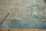 Distressed lower field of antique Peking carpet, with sea foam blue border and faded architecture.