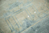 Distressed texture of antique Peking carpet, with sea foam blue architectural patterns and exposed foundation.