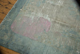 Distressed surface of antique Peking carpet, revealing foundation and bubblegum pink marking.