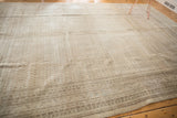 Vintage Mir Sarouk rug corner, geometric border, faded ivory field with visible wear.