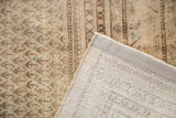 Vintage Mir Sarouk carpet detail showing pile wear, hand-knotted foundation, and secured side.