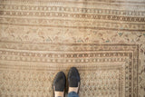 Vintage Mir Sarouk carpet corner, with worn ivory and brown allover boteh field and striped borders.