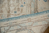 Distressed vintage Sparta carpet pile showing wear, foundation, and secured turquoise blue edge.