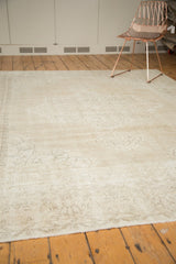 Distressed texture on vintage Sparta rug end, showing subtle European vinery and neutral tones.