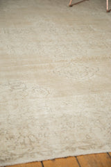 Faded beige Sparta carpet pile texture reveals subtle European scrolling vinery.