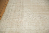Distressed vintage Sparta carpet with faded European vinery and neutral beige, sand texture.