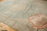 Distressed vintage Sivas carpet, sea foam green and ivory European floral, mostly even wear and exposed foundation.