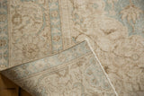 Vintage Sivas carpet close-up, revealing distressed low pile, visible foundation, and woven back.