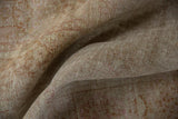 Flowing drape of distressed vintage Kashmir silk, revealing its soft texture and muted palette.