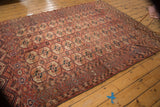 Antique Turkmen carpet's unique side border with germinating plant motifs next to Bokhara guls.