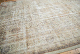 Distressed Sivas carpet detail in ivory, beige, and charcoal, showing wear and foundation.