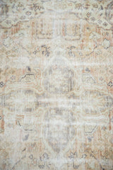 Distressed hand-knotted Sivas carpet pile, showing textured neutral tones and subtle curvilinear patterns.