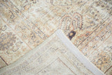 Folded corner of vintage Sivas carpet, revealing secured edge and woven foundation.
