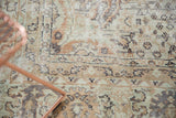 Distressed Sivas carpet showing worn pile, exposed foundation, and muted floral patterns.