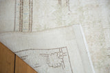 Reverse of hand knotted vintage Sparta carpet, showing foundation and distressed pile with secured edge.