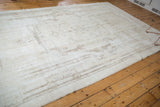 Distressed vintage Sparta carpet with even wear, faint foundation, and coffee brown rococo details.