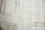 Reverse side of a distressed Sparta rug, detailing its hand-knotted foundation and weave.