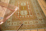 Triple medallion, floral botehs, and Laleh Abassi pawn border on vintage Persian rug.