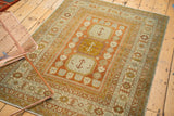 Distressed Northwest Persian rug corner, Laleh Abassi border and burnt orange floral motifs.