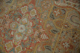 Distressed Armenian rug detail: Sultanabad Mahal design, even wear, terra cotta, sage, and blue.