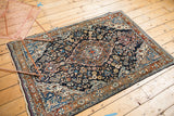 Vintage Persian Sarouk rug corner, with a Jozan meandering vine border and rich floral field.