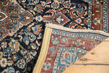 Folded corner of the Vintage Sarouk rug revealing its detailed hand-knotted foundation and finished selvedge.