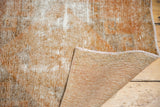 Distressed Oushak rug texture with mostly even wear to knot heads and hand-knotted woven back.