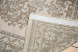 Vintage Distressed Oushak Carpet reverse, revealing tight weave, secured edge, and low pile front.
