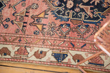 Antique Malayer rug runner with lovebird motifs on dusty rose field and ivory border.