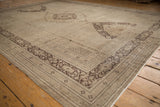 Distressed ivory field and charcoal brown serrated contour border of a vintage Khorassan rug.