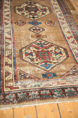 Antique Serab geometric medallion on a time-softened natural camel field, visible foundation.
